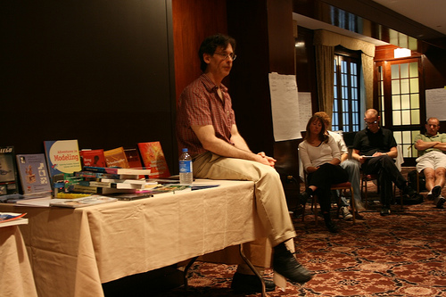 Alfie Kohn sitting in the classroom library